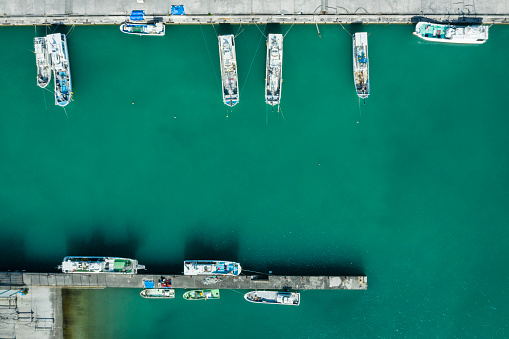 boats lying in a harbor at the red sea in egypt in the summer