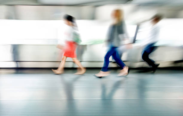 istock Blurred people walking in a corridor 1080092060