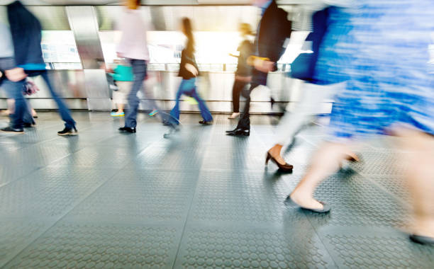istock Blurred people walking in a corridor 1080092544