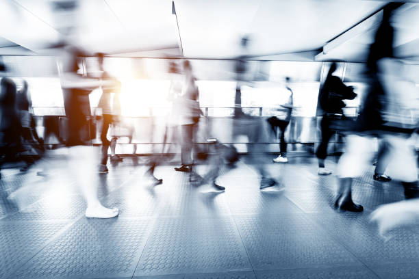 istock Blurred people walking in a corridor 1080092774