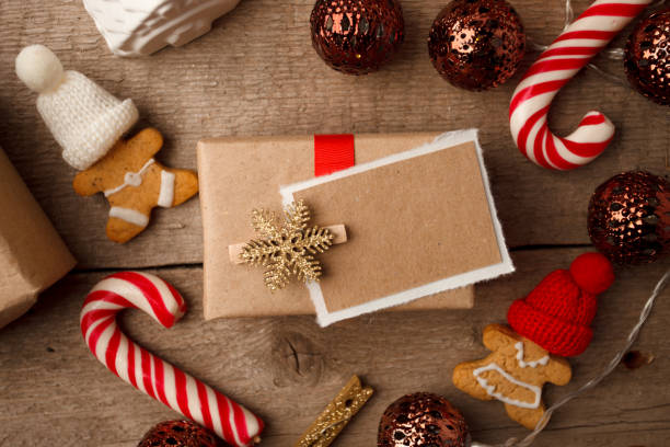 istock Christmas Decorations with Gingerbread man, candy cane, gift box with copy space, festive decorative toy. Hygge rustic xmas decorative background, top view, flat lay 1080093286