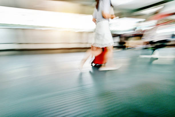 istock Woman walking with a suitcase 1080093576