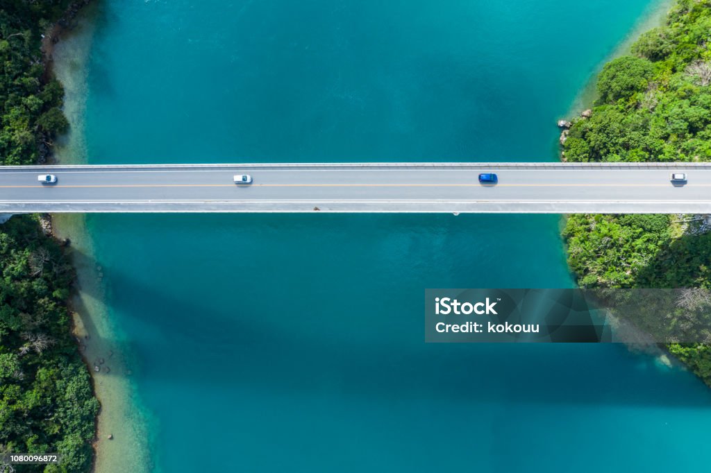 Aerial photograph of the beautiful sea and bridge. Clear ocean.
Viewpoint from directly above. Bridge - Built Structure Stock Photo