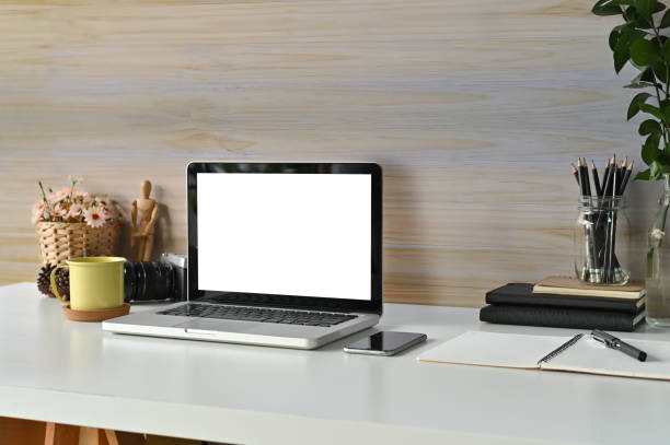 istock Workspace mockup laptop computer, coffee mug, books and office supplies on desk work. 1080100988