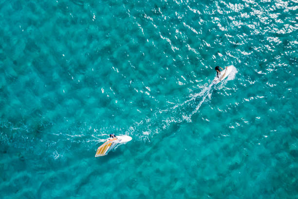 istock Two yachts running in the sea to chase 1080103940