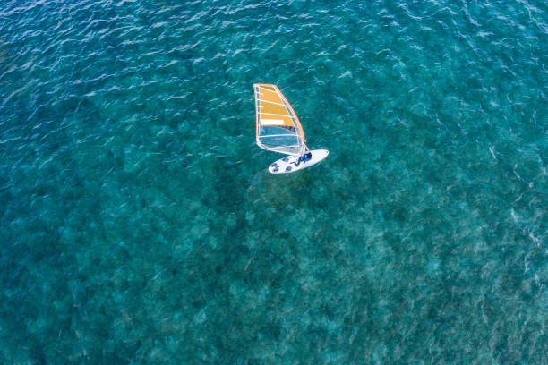 istock Someone who enjoys sailing in the beautiful sea 1080104496