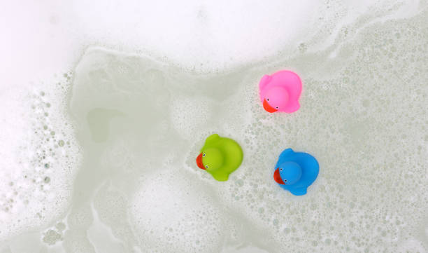 istock Pink, green and blue duck in a bathtub 1080108094