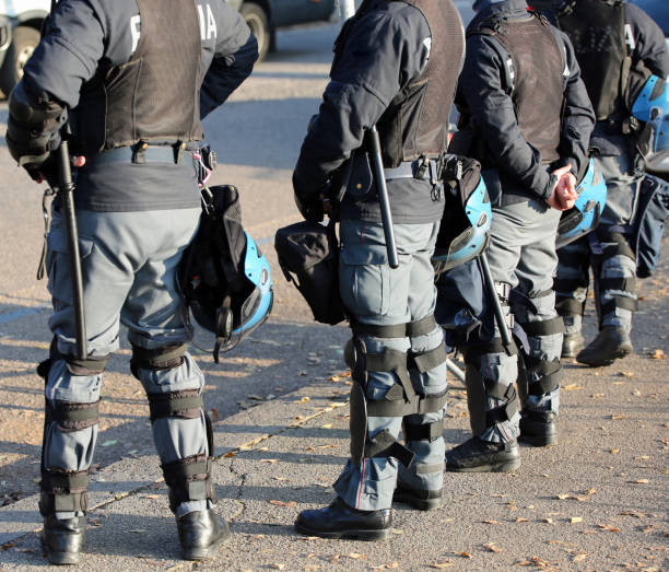 istock police in riot gear with flak jackets and protective helmets 1080108394