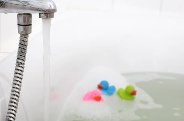 istock Pink, green and blue duck in a bathtub 1080108530