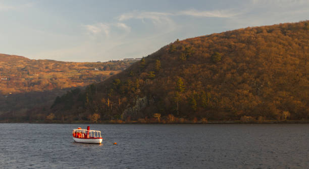 istock Boat on an autumn lake by the mountains 1080110652