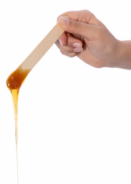 istock Honey wax on a spatula - Isolated 1080111394