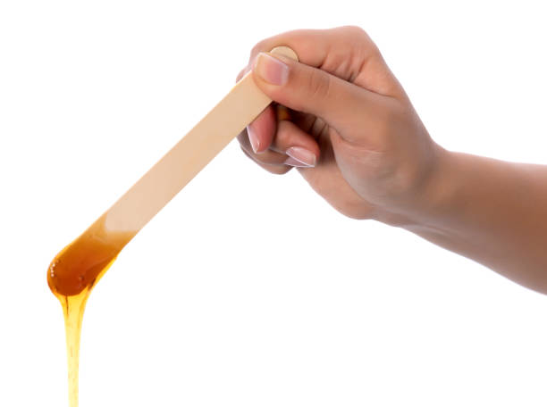 istock Honey wax on a spatula - Isolated 1080111410