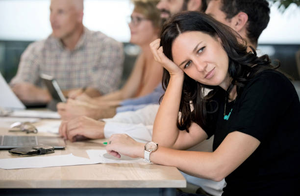 istock Businesswoman getting bored while attending presentation in office. 1080115386