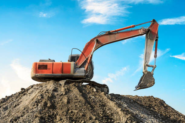 istock Excavator working at building site on sunny day 1080120308