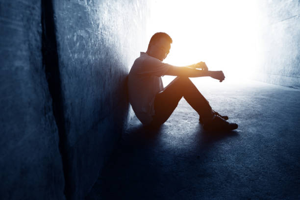 istock Desperate man sitting in the tunnel 1080121232