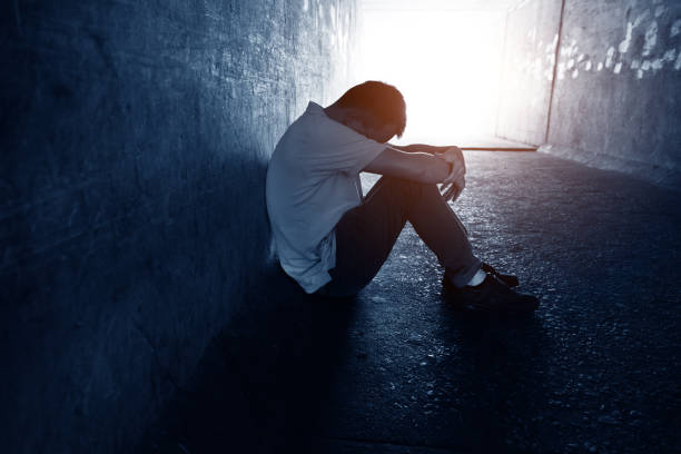 istock Desperate man sitting in the tunnel 1080121302