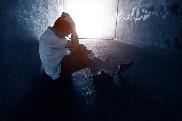 istock Desperate man sitting in the tunnel 1080121500