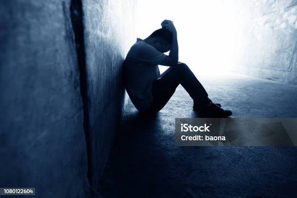 Desperate Man Sitting In The Tunnel Stock Photo - Download Image Now - Depression - Sadness, Men, Sadness