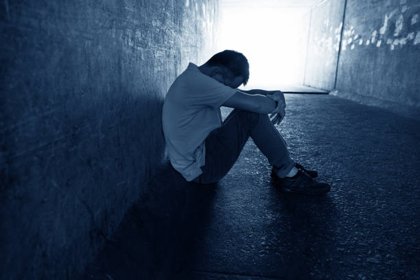 istock Desperate man sitting in the tunnel 1080122682