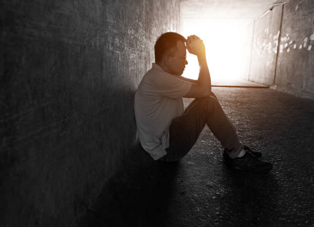 istock Desperate man sitting in the tunnel 1080122742