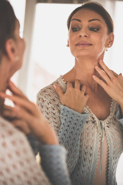 istock Woman looking at the mirror 1080122830