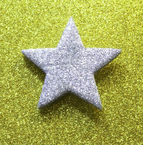 istock silver star in brilliant yellow green golden background 1080124042