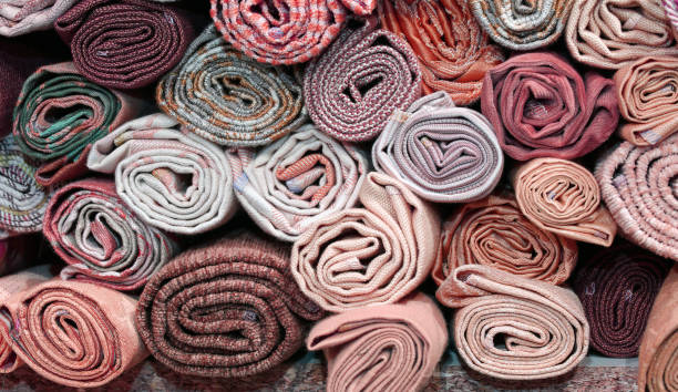 istock rolls of precious fabric on the shelf 1080125066