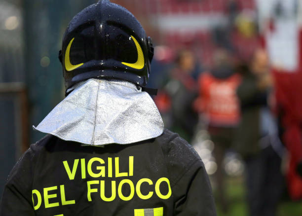 istock Italian firefighter with uniform with the written FIREFIGHTERS 1080131580
