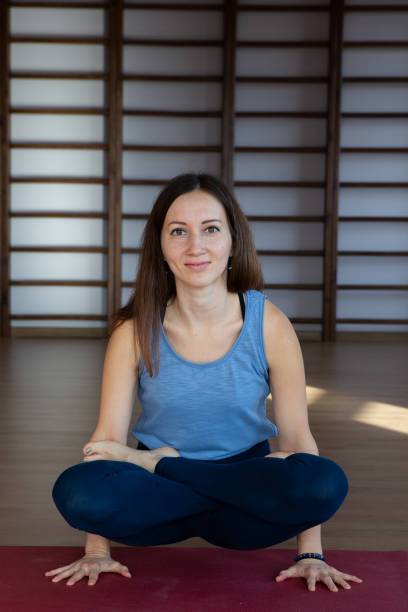 istock Beautiful woman practicing yoga indoors 1080136534