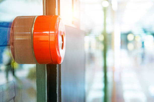 Fire alarm on wall of shopping mall.