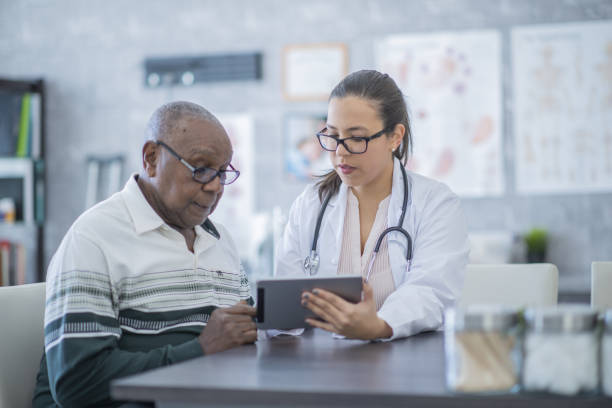 istock Man consults with his doctor 1080141274