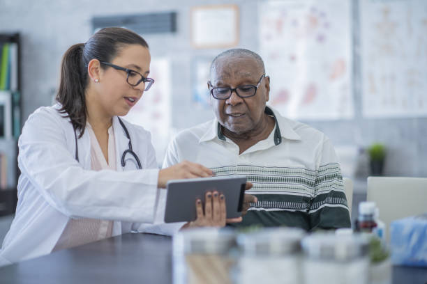 istock Doctor with senior patient 1080141282