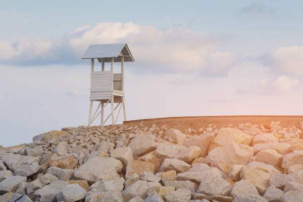 istock Lifeguard stand over coastline 1080142184