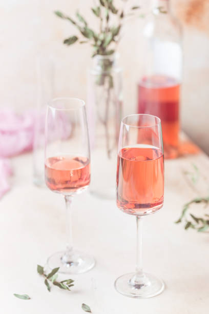 istock Two glasses and bottle of rose wine 1080142748