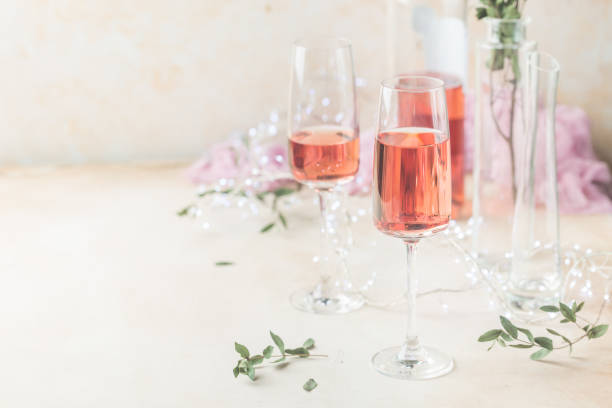 istock Two glasses and bottle of rose wine 1080142768