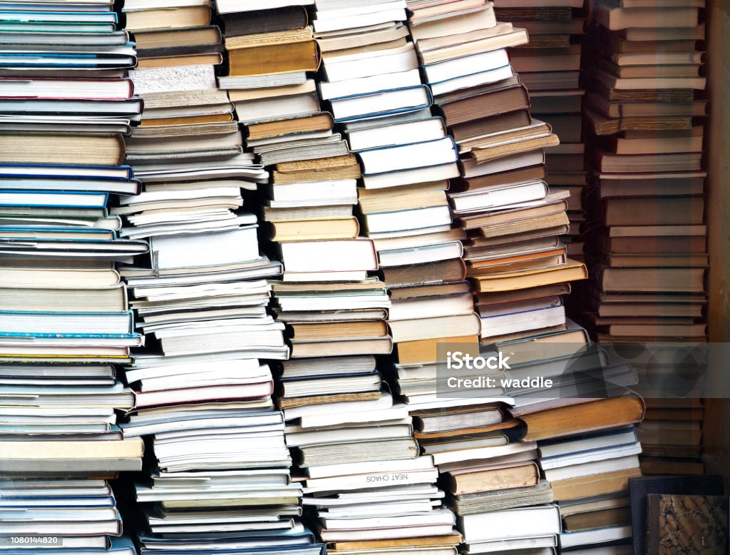 Piles of books Books neatly chaotic display Book Stock Photo