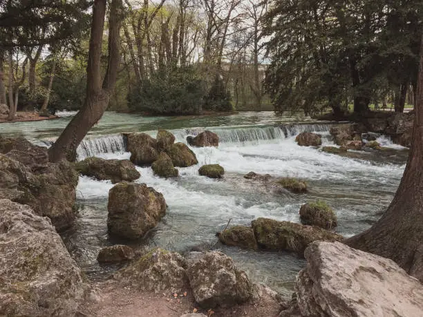 Photo of Artificial river flowing thru the English garden famous city park in Munich