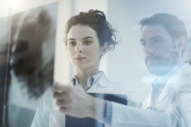 istock Doctors team examining a patient's x-ray 1080156956