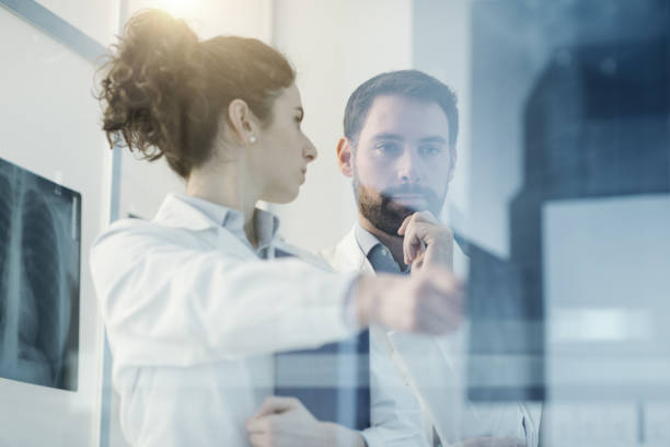 istock Doctors team examining a patient's x-ray 1080157138