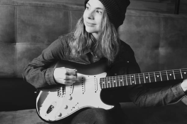 istock Young woman playing guitar. 1080167274