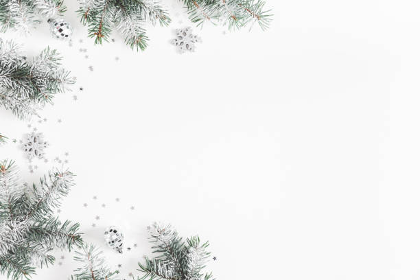 istock Christmas composition. Frame made of fir tree branches, silver decorations on white background. Christmas, winter, new year concept. Flat lay, top view, copy space 1080167374