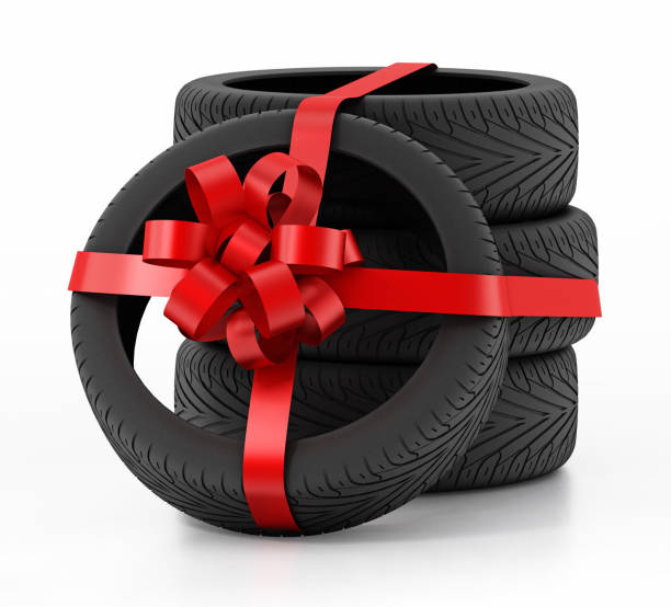 istock New tires wrapped with red ribbon 1080167902