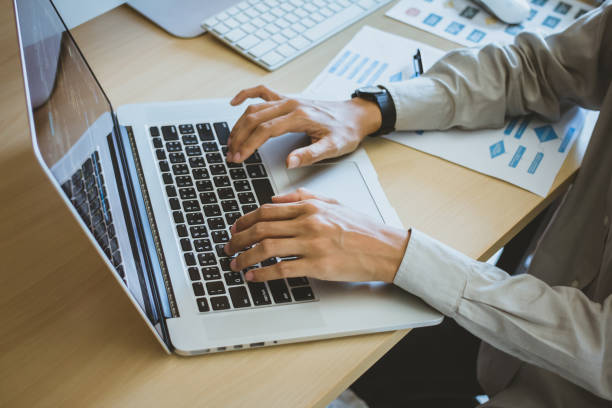 newsletter concept hand of businessman checking message box on digital laptop vintage tone filter.top view - communication marketing dictionary global communications imagens e fotografias de stock