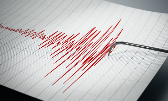 Seismograph recording the seismic activity of an earthquake