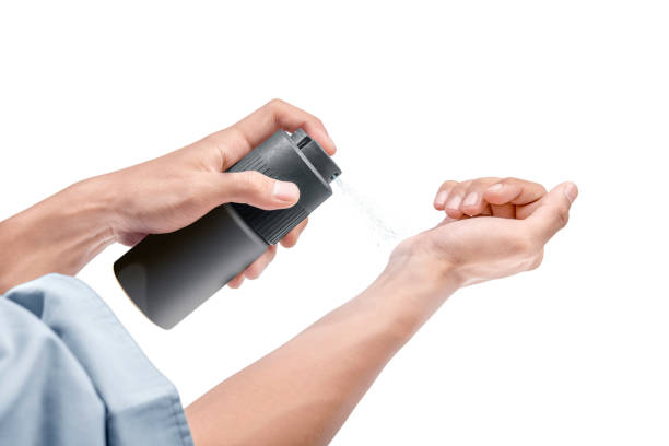 istock Businessman spraying perfume on his hands 1080173920