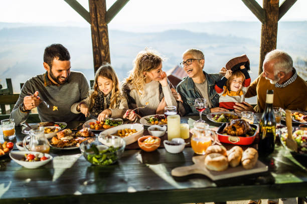 istock Happy extended family talking during lunch on a terrace. 1080174234