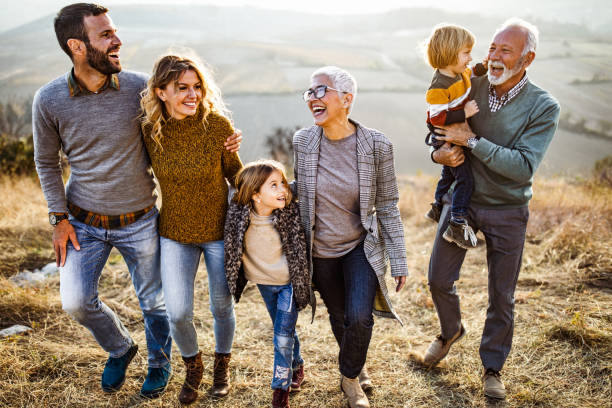 istock Happy multi-generation family talking while taking a walk on the field. 1080174848