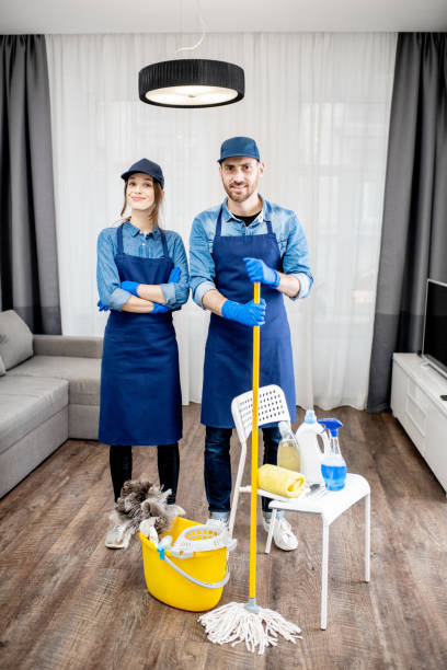 istock Professional cleaners with cleaning tools indoors 1080174992