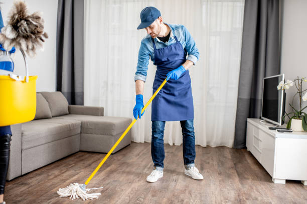 istock Man cleaner washing floor in the apartment 1080175374