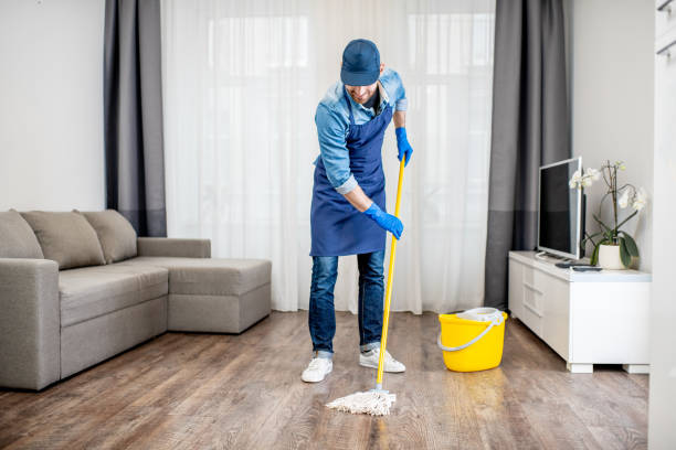 Man washing floor in the apartment